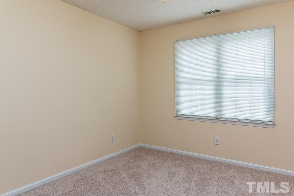 12404 Harcourt Drive Raleigh, NC 27613 - Photo 17 of 22 an empty room with a window