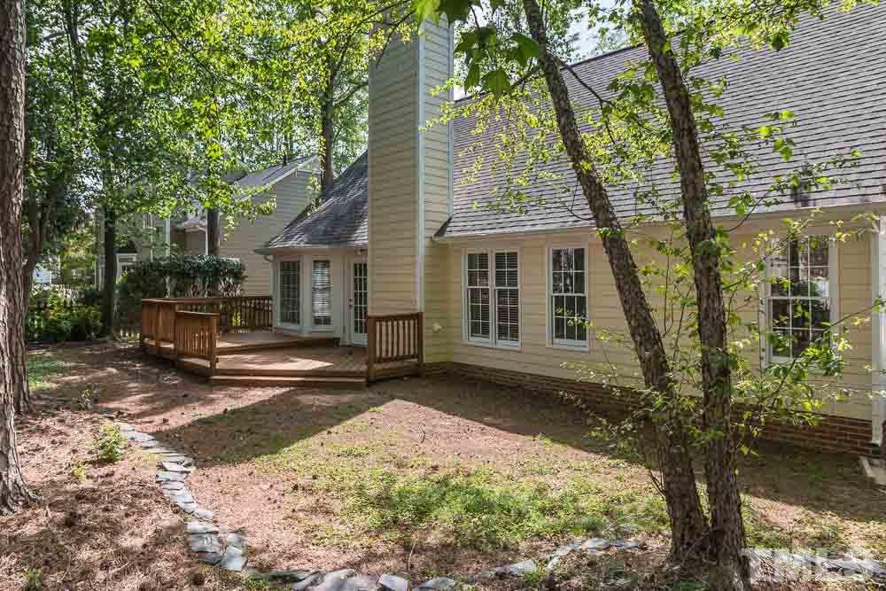 12404 Harcourt Drive Raleigh, NC 27613 - Photo 18 of 22 front view of a house with a yard