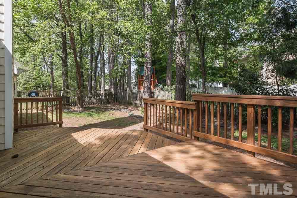 12404 Harcourt Drive Raleigh, NC 27613 - Photo 19 of 22 a view of backyard with a deck and wooden floor