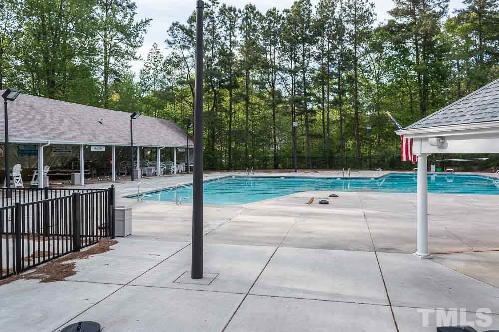 12404 Harcourt Drive Raleigh, NC 27613 - Photo 20 of 22 a backyard of a house with trampoline