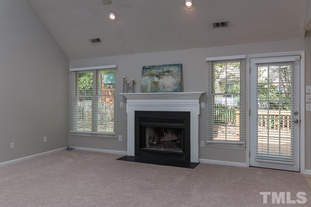 12404 Harcourt Drive Raleigh, NC 27613 - Photo 5 of 22 a living room with furniture and a fireplace