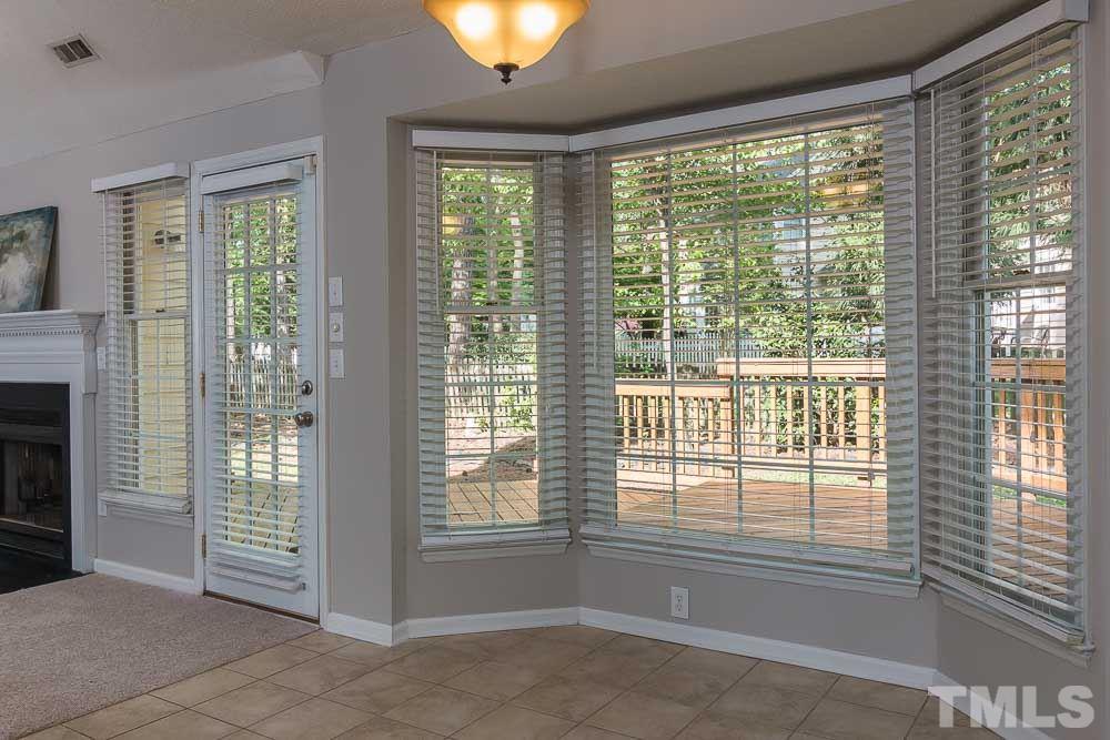 12404 Harcourt Drive Raleigh, NC 27613 - Photo 7 of 22 a view of an empty room with a window