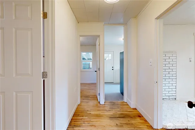 a view of a bathroom from a hallway