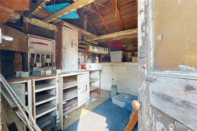 a view of dinning room and shelves