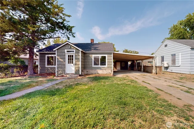 front view of a house with a yard