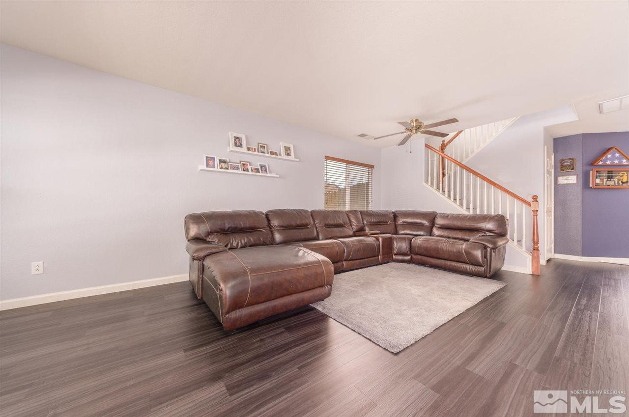 8924 Grisom Way Reno, NV 89506 - Photo 4 of 22 a living room with furniture and a wooden floor