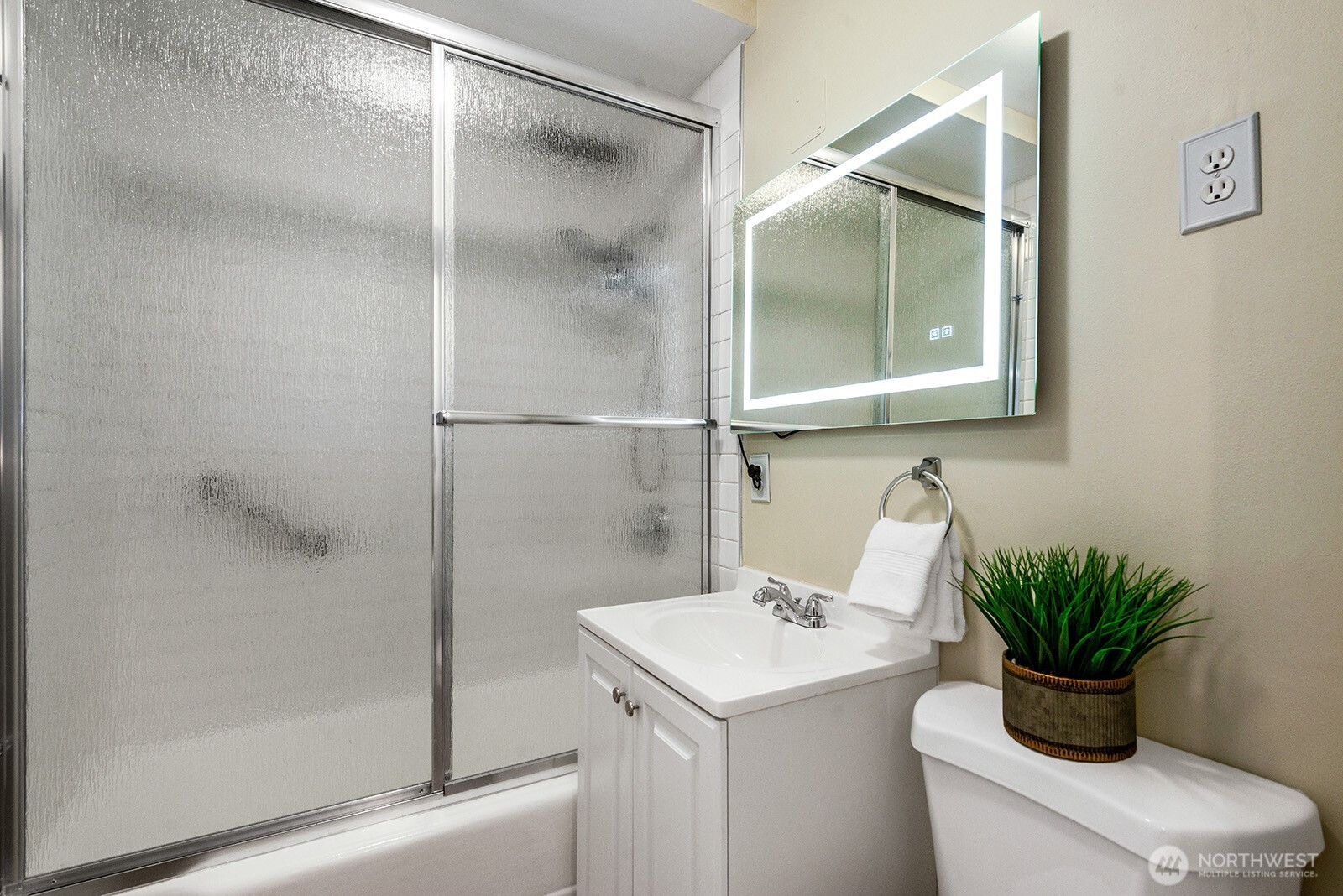 4407 Southwest Alaska Street, Unit 11 Seattle, WA 98116 - Photo 12 of 24 a bathroom with a shower toilet and sink