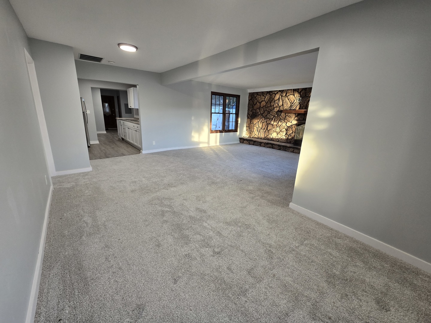 1007 North River Road McHenry, IL 60051 - Photo 3 of 26 a view of an empty room and window