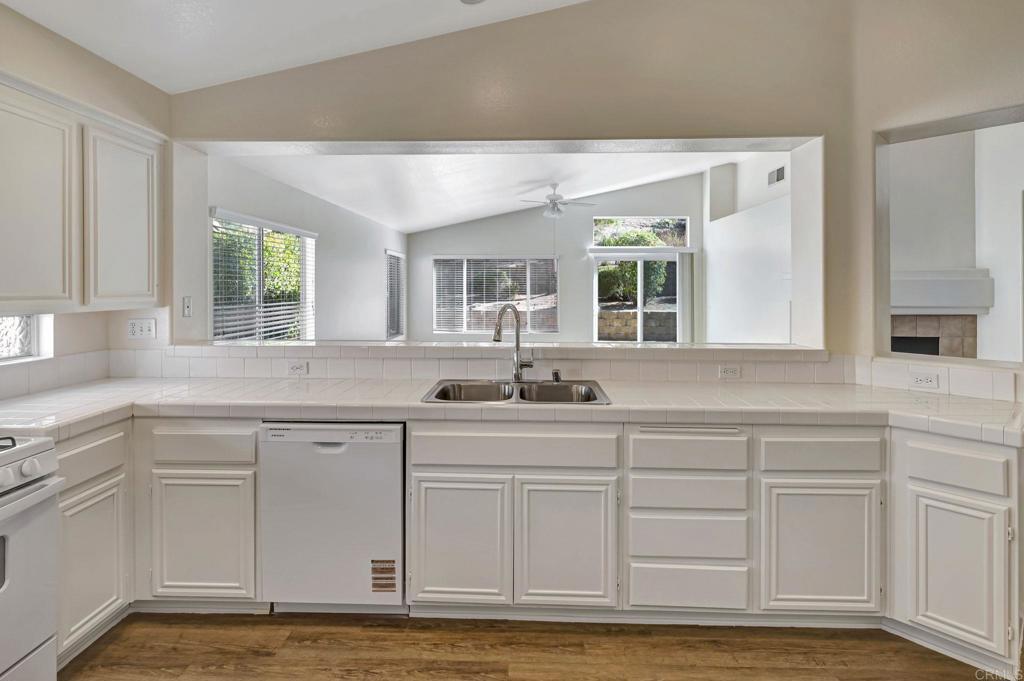 2775 Lobelia Road Alpine, CA 91901 - Photo 11 of 25 a kitchen with sink cabinets and window