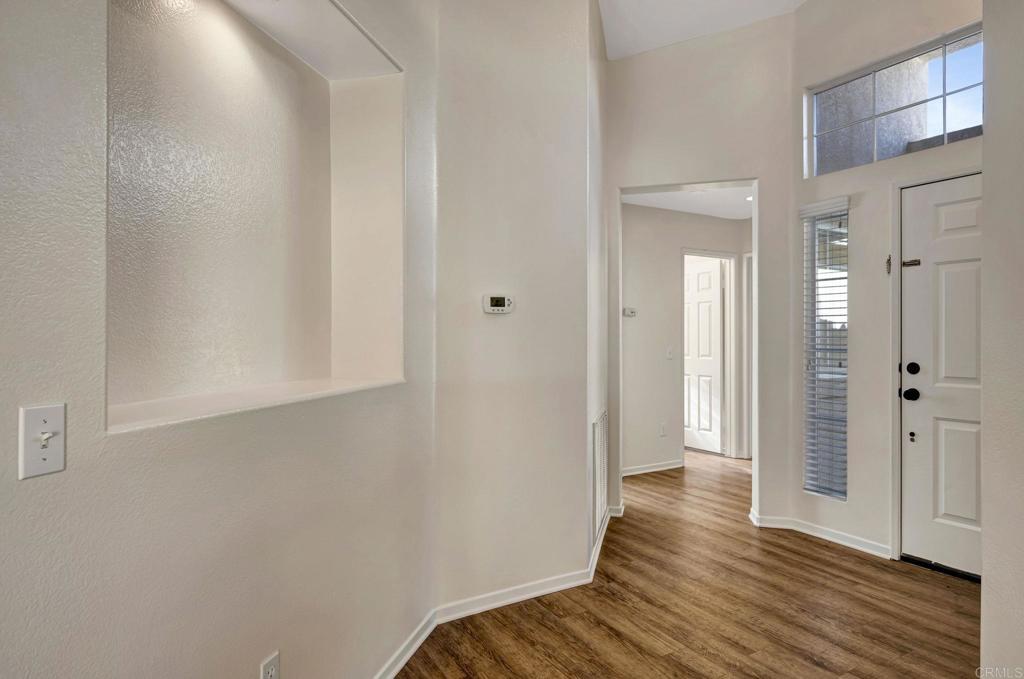 2775 Lobelia Road Alpine, CA 91901 - Photo 14 of 25 a view of a hallway with wooden floor and staircase