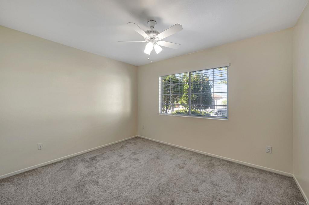 2775 Lobelia Road Alpine, CA 91901 - Photo 15 of 25 an empty room with a window and a ceiling fan