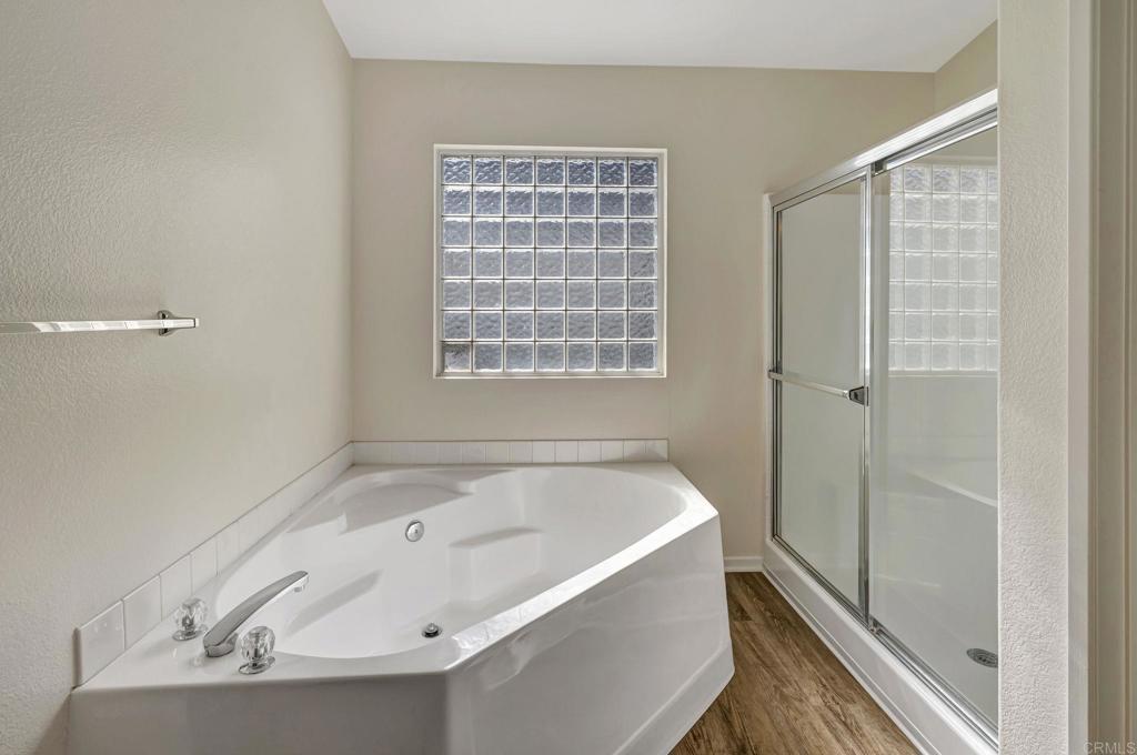 2775 Lobelia Road Alpine, CA 91901 - Photo 16 of 25 a white bath tub sitting next to a shower