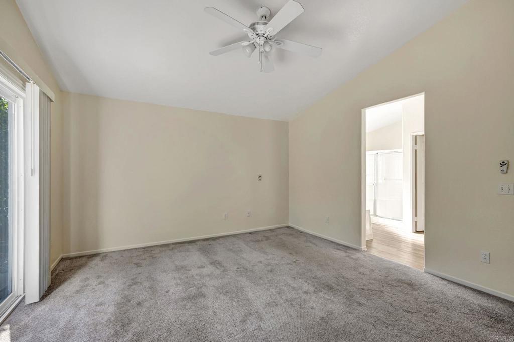 2775 Lobelia Road Alpine, CA 91901 - Photo 17 of 25 an empty room with a window and a fan