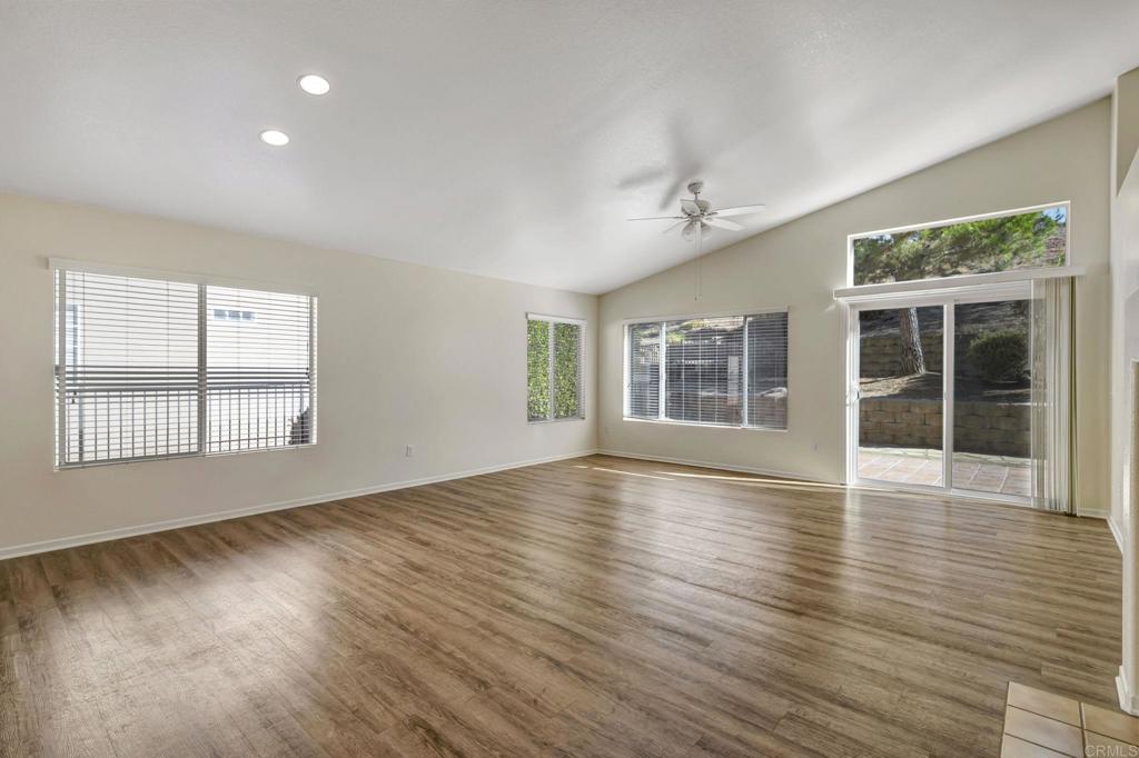 2775 Lobelia Road Alpine, CA 91901 - Photo 4 of 25 a view of an empty room with wooden floor and a window
