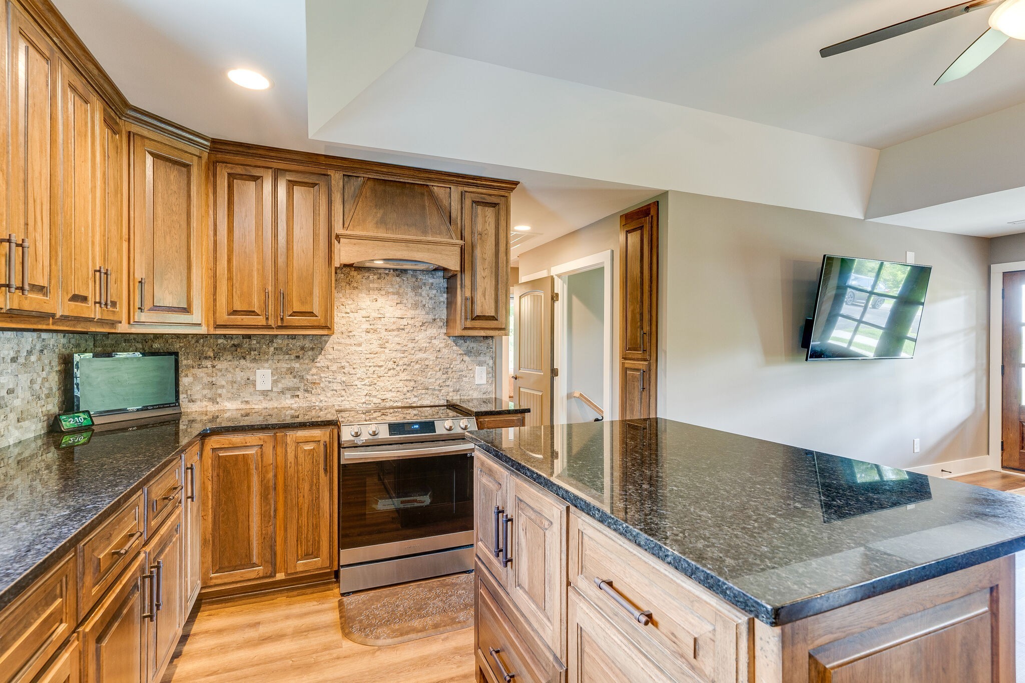 6626 Herbert Shannon Road Springfield, TN 37172 - Photo 12 of 19 a kitchen with stainless steel appliances granite countertop a sink stove and cabinets