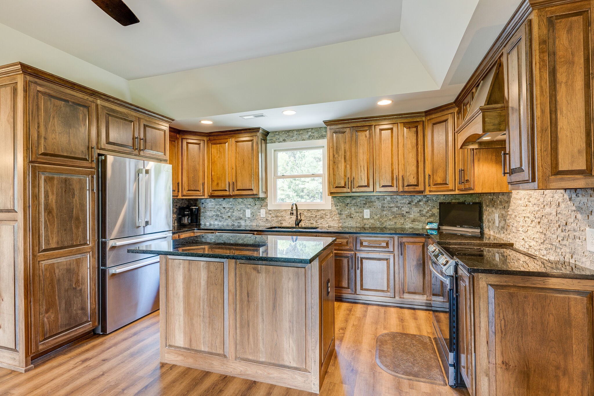 6626 Herbert Shannon Road Springfield, TN 37172 - Photo 10 of 19 a kitchen with granite countertop stainless steel appliances a refrigerator stove top oven and sink
