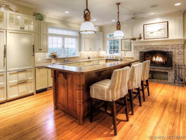 6736 Ware Neck Road Gloucester, VA 23061 - Photo 11 of 34 Thoroughly upscale kitchen holds huge appeal for the cook and the entertainer in you...Heart Pine floors and fireplace are sure to please.