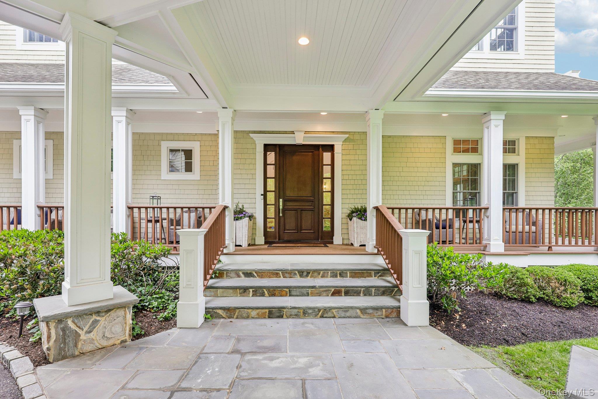 5 Mill Road Lloyd Harbor, NY 11743 - Photo 4 of 49 a front view of a house with a porch