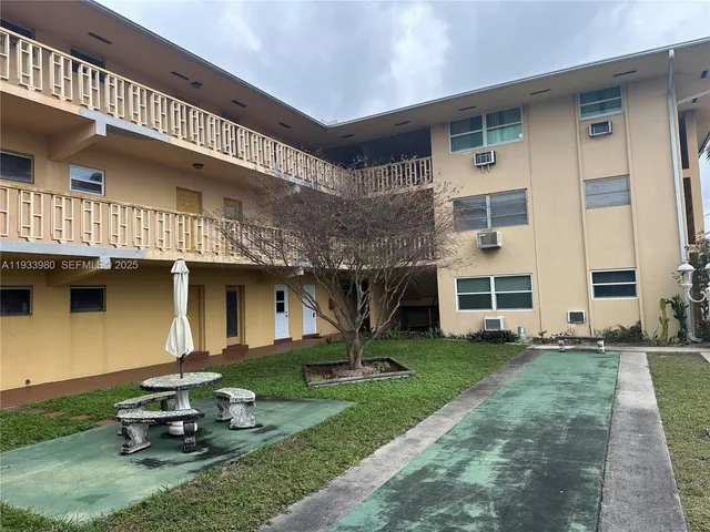 a house view with a garden space