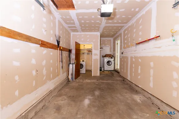 a view of a hallway with stairs