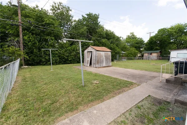 a backyard of a house with entertaining space
