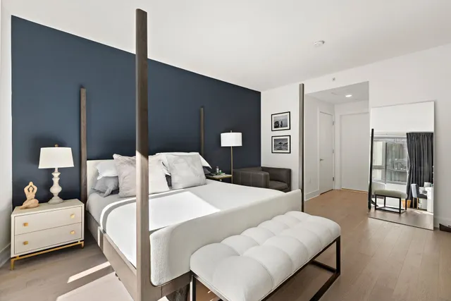 a bedroom with a bed and a table