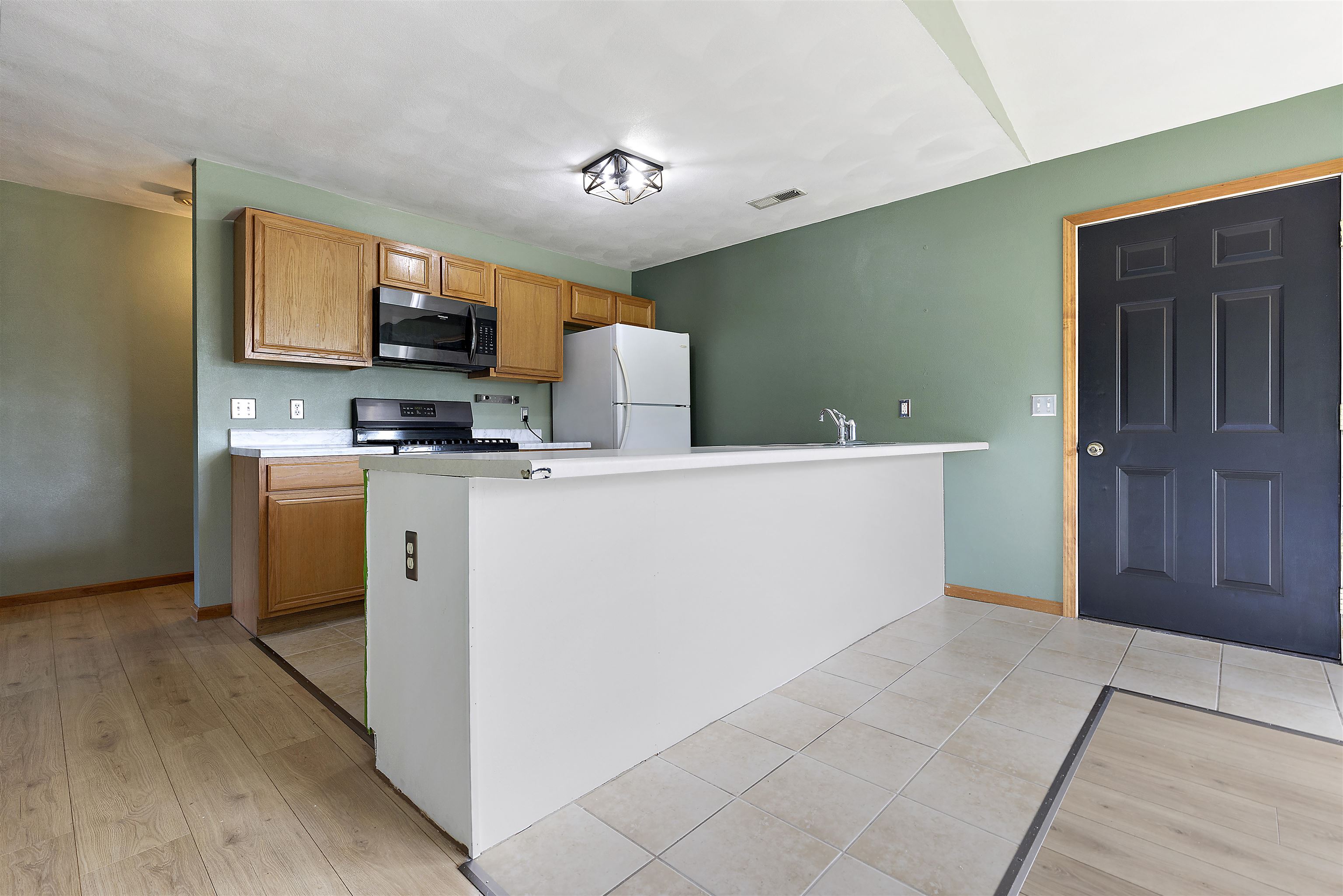 10050 Skipperling Road Roscoe, IL 61073 - Photo 5 of 15 a utility room with cabinets washer and dryer