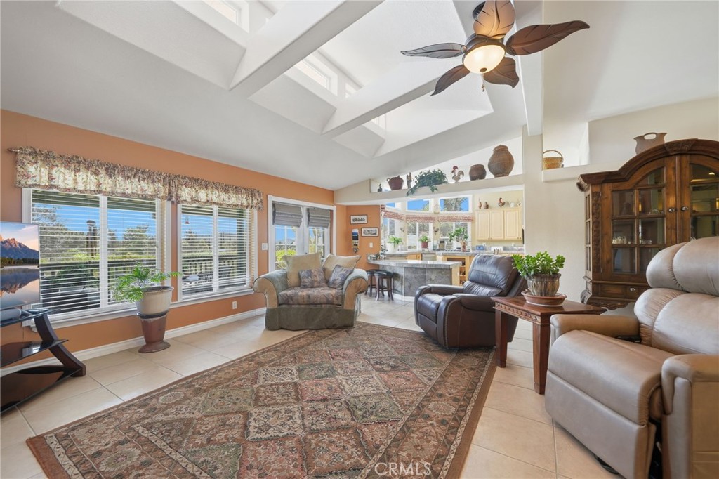 35780 Greer Road Murrieta, CA 92562 - Photo 13 of 56 HUGE great room w upper windows for additional illumination, tiled flooring and windows overlooking back patio and pool
