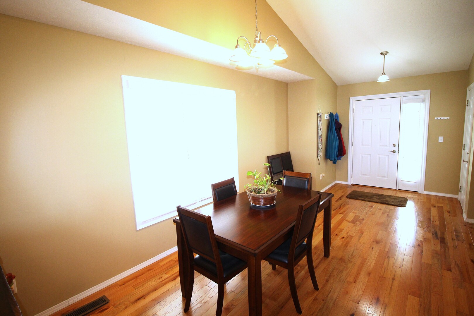 25 Oak Park Road Bloomington, IL 61701 - Photo 3 of 28 a view of a workspace with furniture and wooden floor