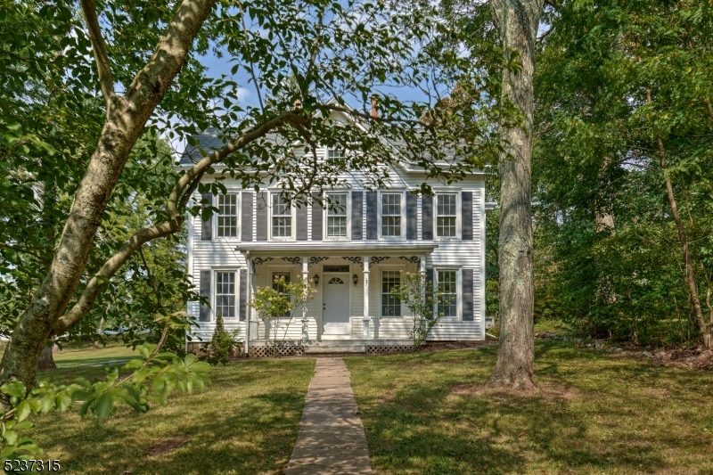 7 Old Highway 28 Whitehouse Station, NJ 08889 - Photo 1 of 34 a front view of a house with a garden