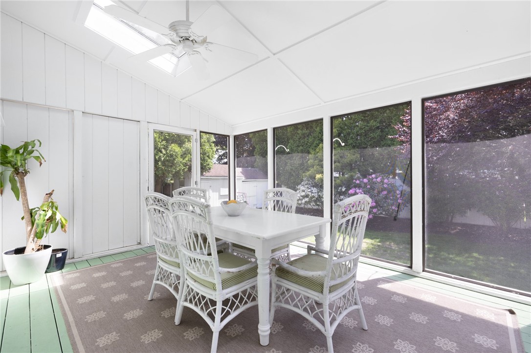 8 Schoolhouse Road Narragansett, RI 02882 - Photo 11 of 41 A breath of fresh air any time of year....access to yard from both sides of porch. Ceiling fan for added cooling.