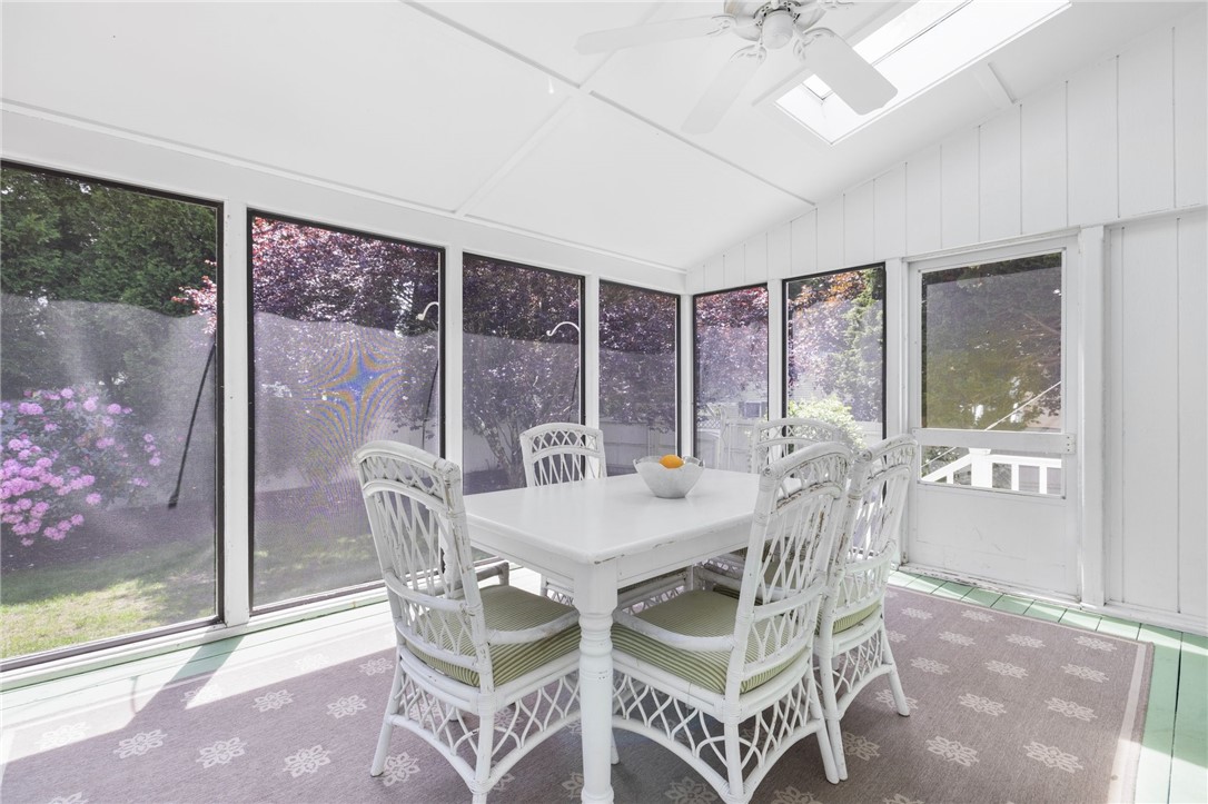 8 Schoolhouse Road Narragansett, RI 02882 - Photo 12 of 41 A peaceful room to enjoy inside and outside living, as well as the rear yard that is full of blooming bushes and trees.