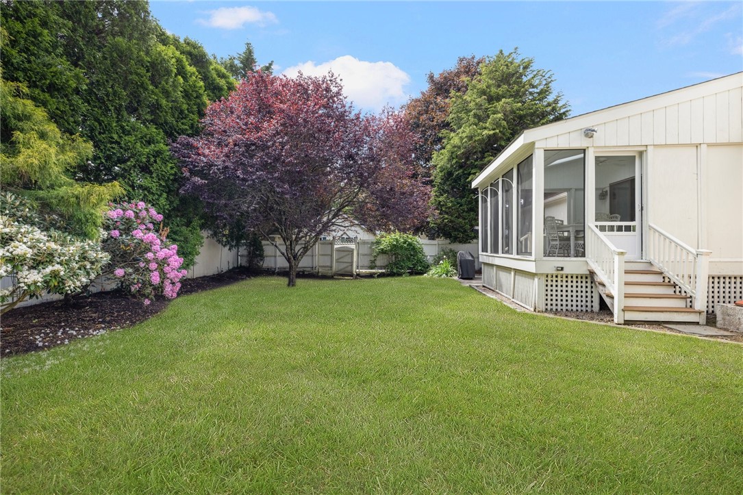 8 Schoolhouse Road Narragansett, RI 02882 - Photo 13 of 41 Rear yard that is not only beautiful but functional for sports, games and more.