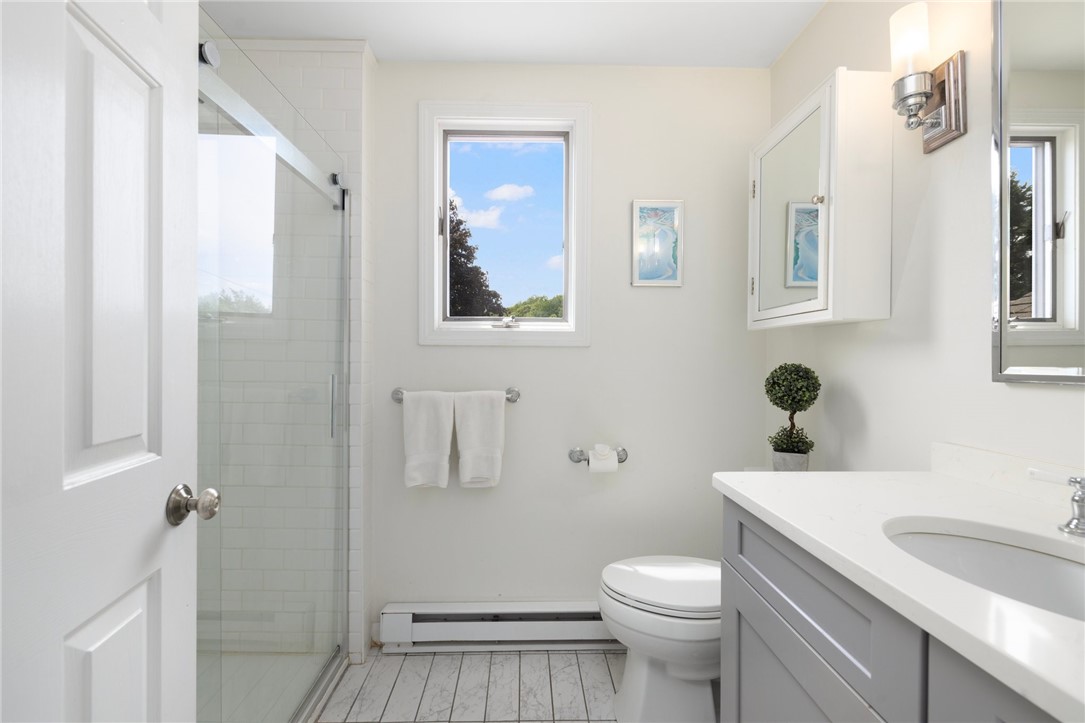 8 Schoolhouse Road Narragansett, RI 02882 - Photo 31 of 41 Primary bath redone in 2016. Notice the 6' wide walk-in shower on the left.