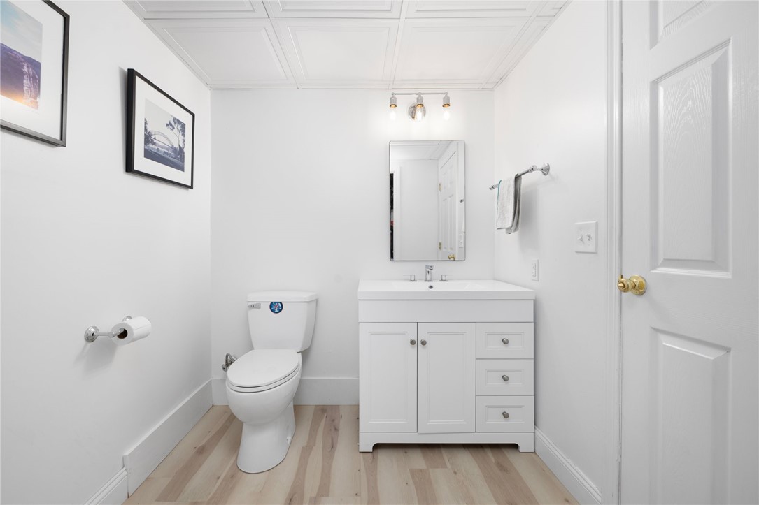 8 Schoolhouse Road Narragansett, RI 02882 - Photo 36 of 41 Convenient half bath to accommodate all who are enjoying the workout room and game area on the lower level.
There is a storage room off the bath not shown in photo.