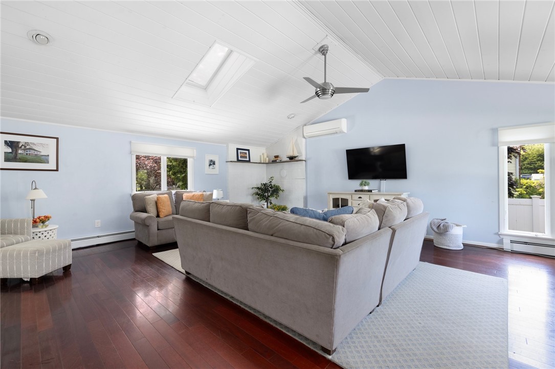 8 Schoolhouse Road Narragansett, RI 02882 - Photo 5 of 41 Walk into this dramatic and spacious family room with ship lap covered cathedral ceilings, hardwood floors and lots of natural light.