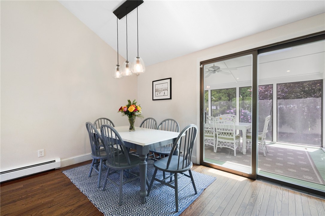 8 Schoolhouse Road Narragansett, RI 02882 - Photo 10 of 41 A dramatic ceiling line, contemporary lighting and sliders to the screened porch.