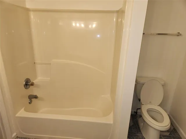 a view of a room with wooden floor and window