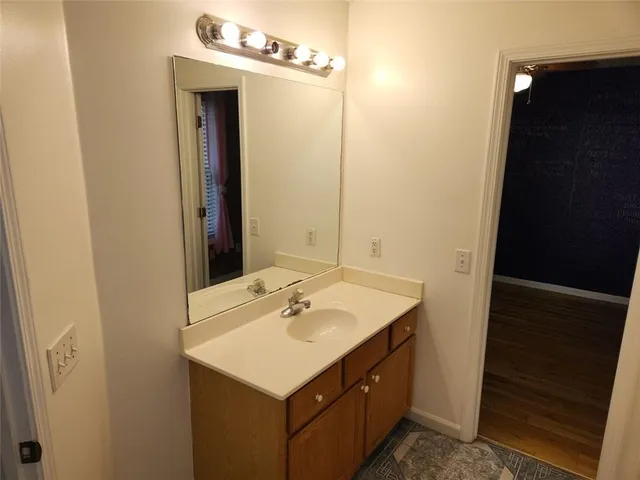 a view of an empty room and wooden floor