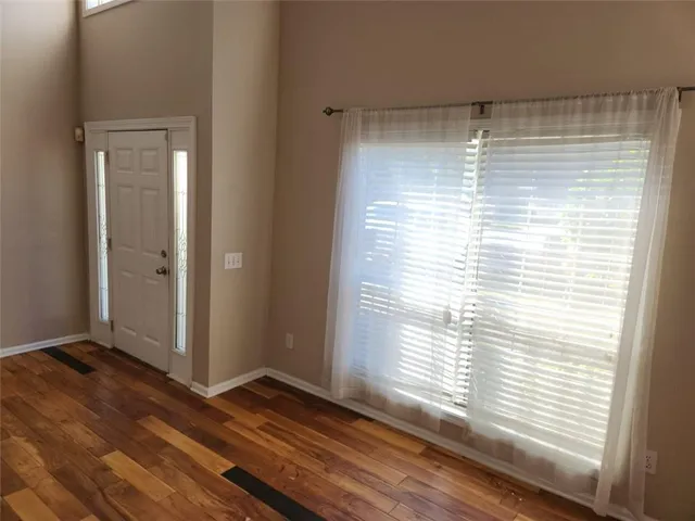 a view of entryway with wooden floor