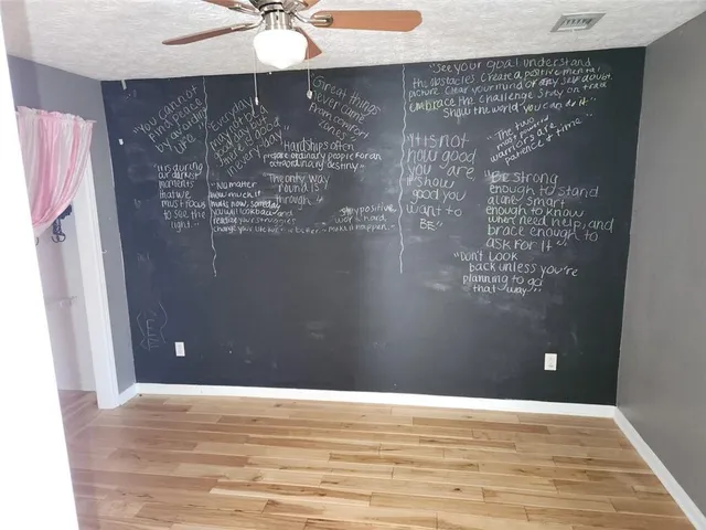 a bedroom with a bed and a fireplace