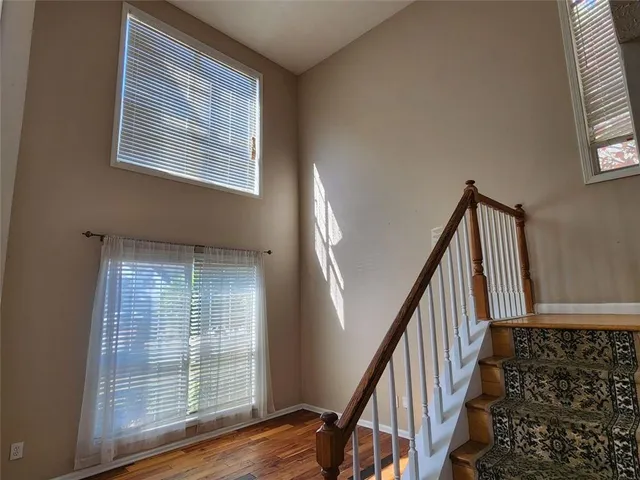 a white toilet sitting next to a small yard