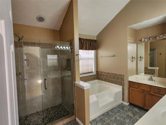 a bathroom with a bathtub and a sink