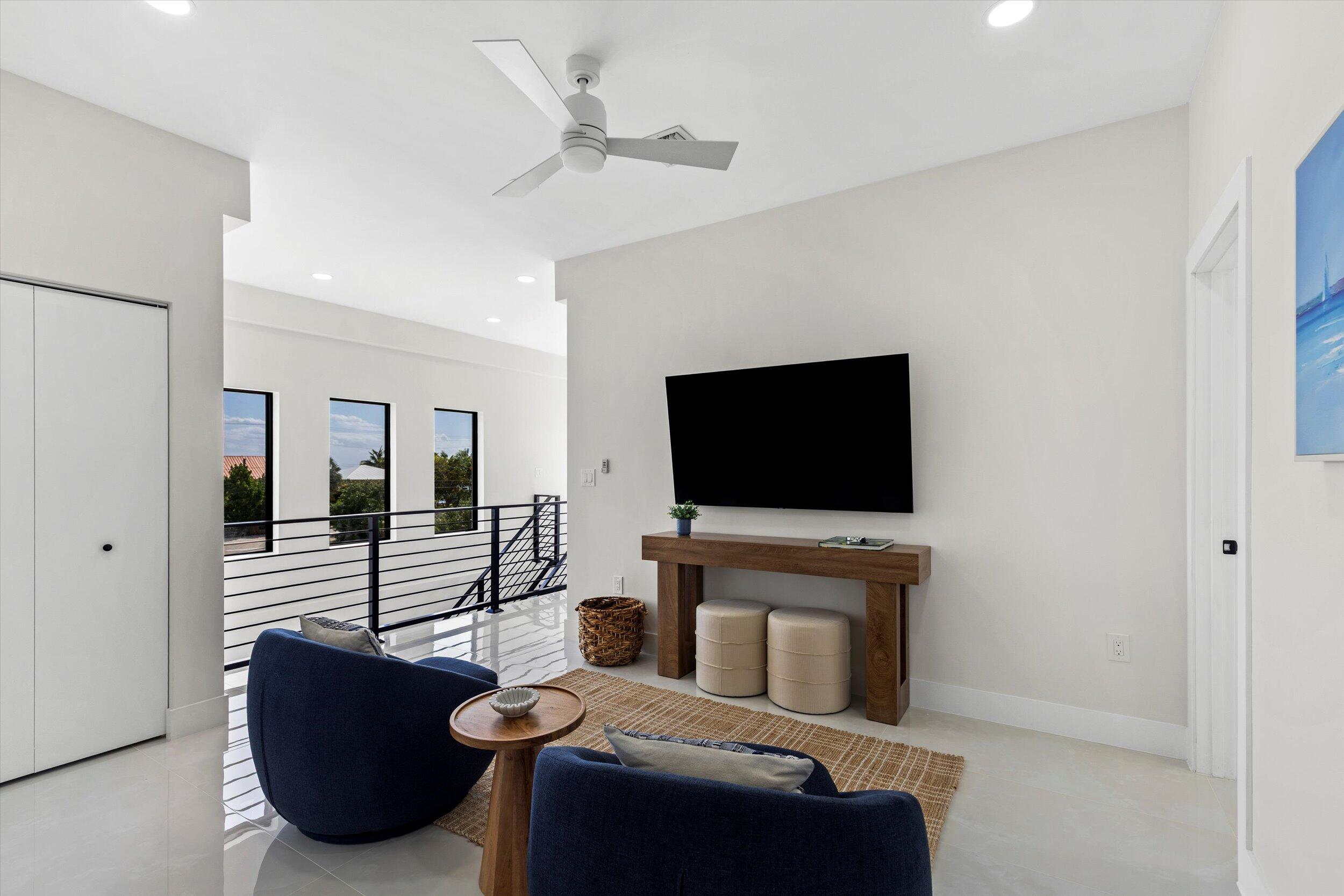 27433 Antigua Road Summerland Key, FL 33042 - Photo 41 of 64 a living room with furniture and a flat screen tv