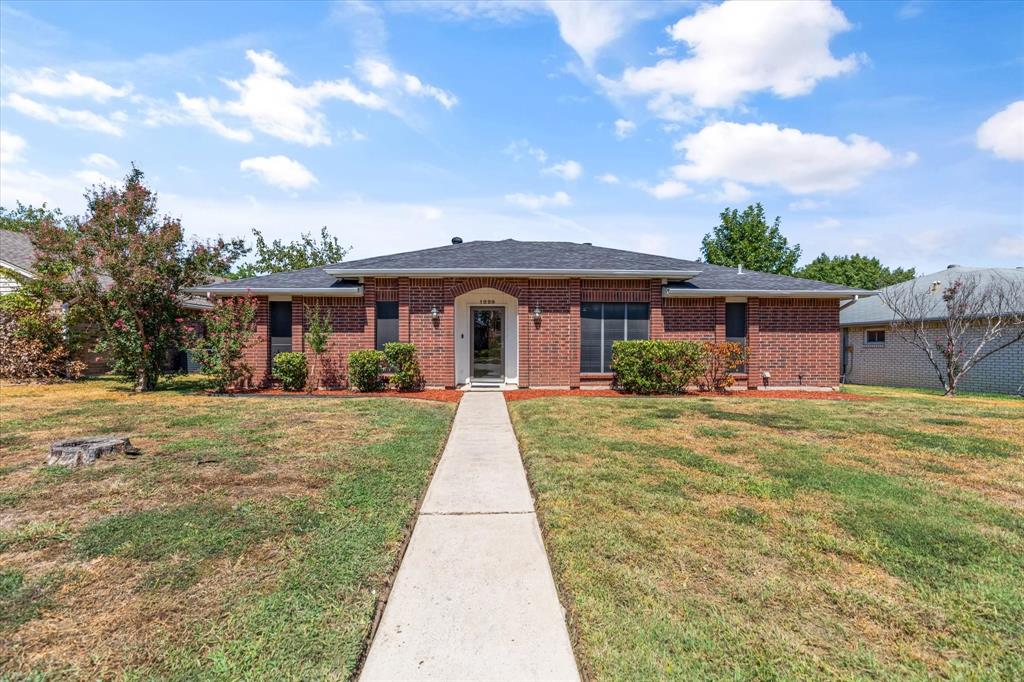 1229 Devonshire Lane Mesquite, TX 75150 - Photo 1 of 1 a front view of a house with a yard
