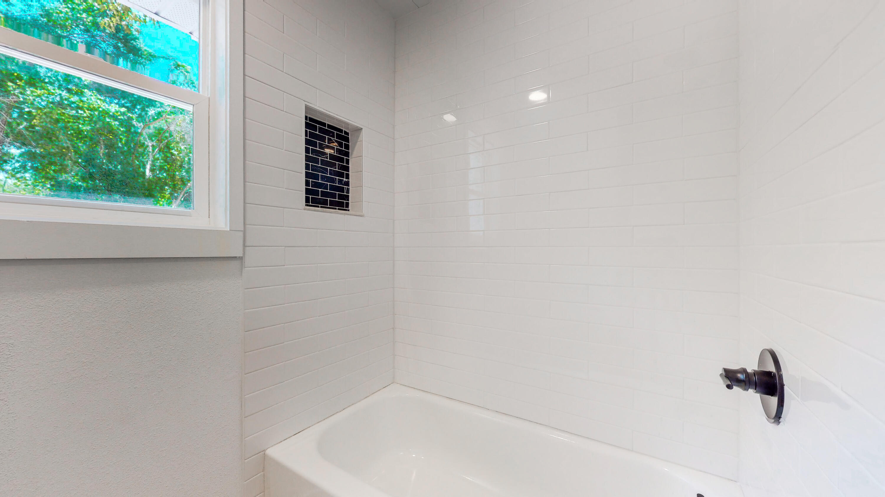 2522 Kingston Road Crestview, FL 32536 - Photo 16 of 43 a bathroom with a shower and a window