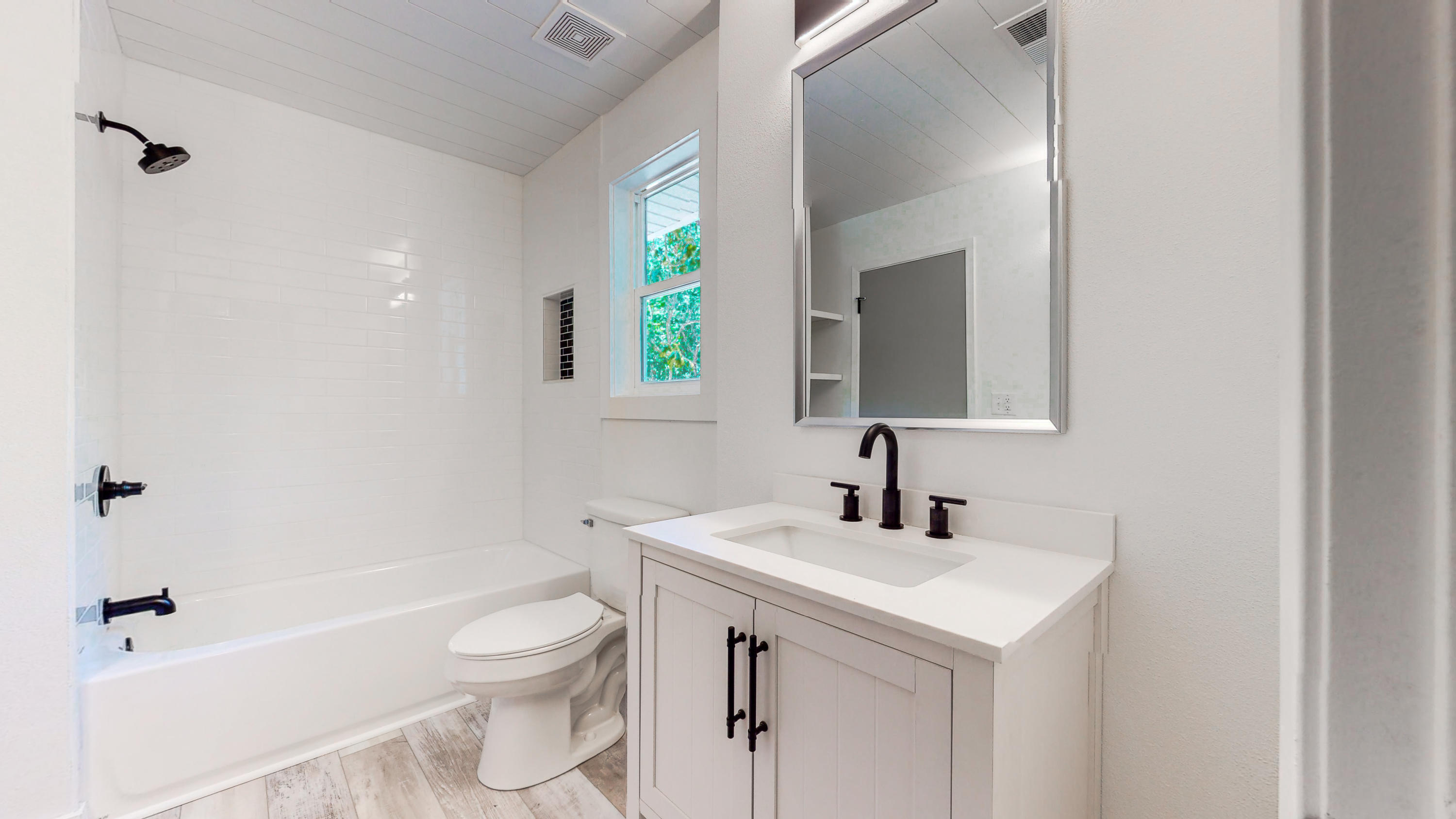 2522 Kingston Road Crestview, FL 32536 - Photo 21 of 43 a bathroom with a toilet sink and mirror