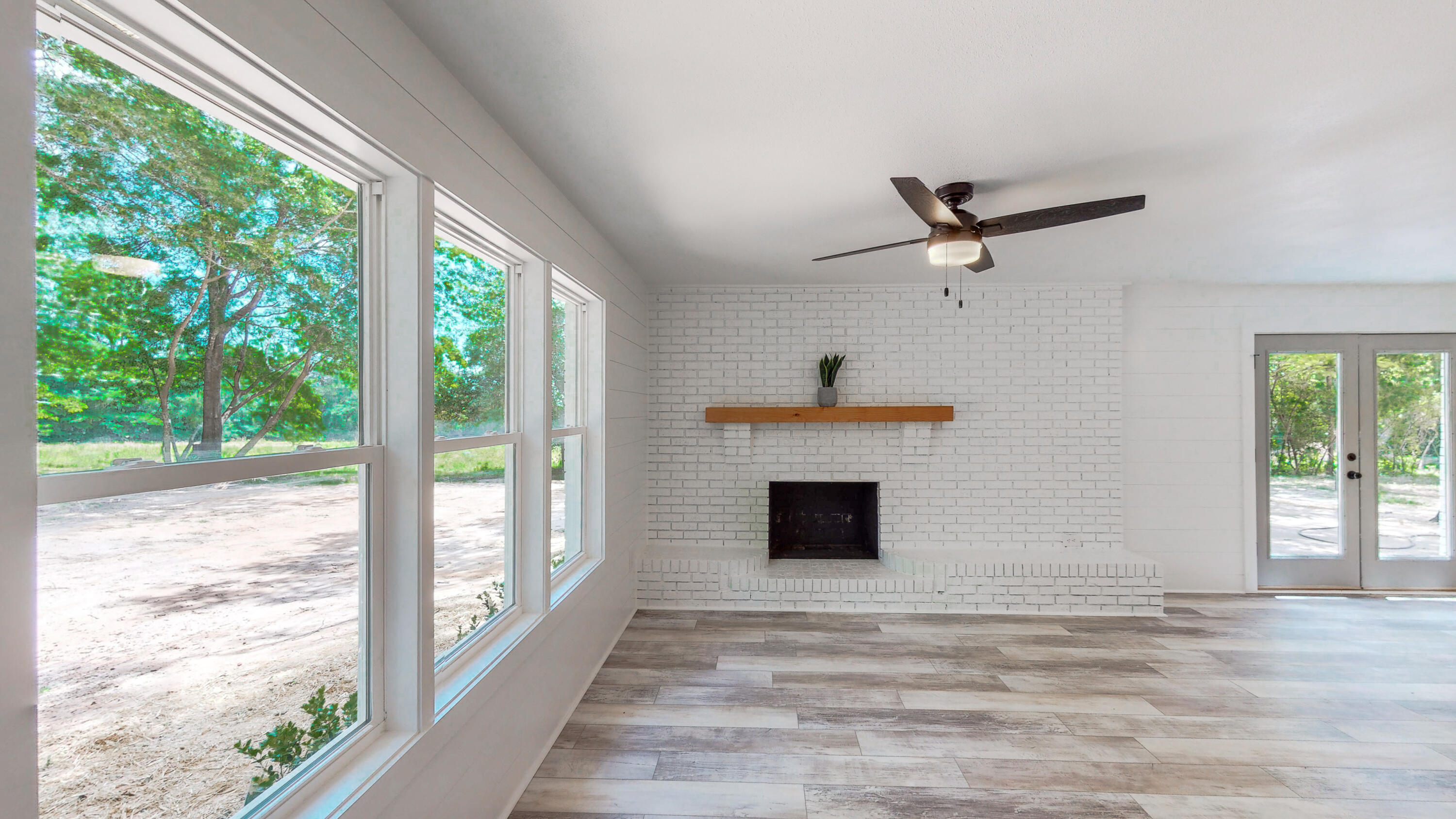 2522 Kingston Road Crestview, FL 32536 - Photo 23 of 43 a view of empty room with fireplace and a window