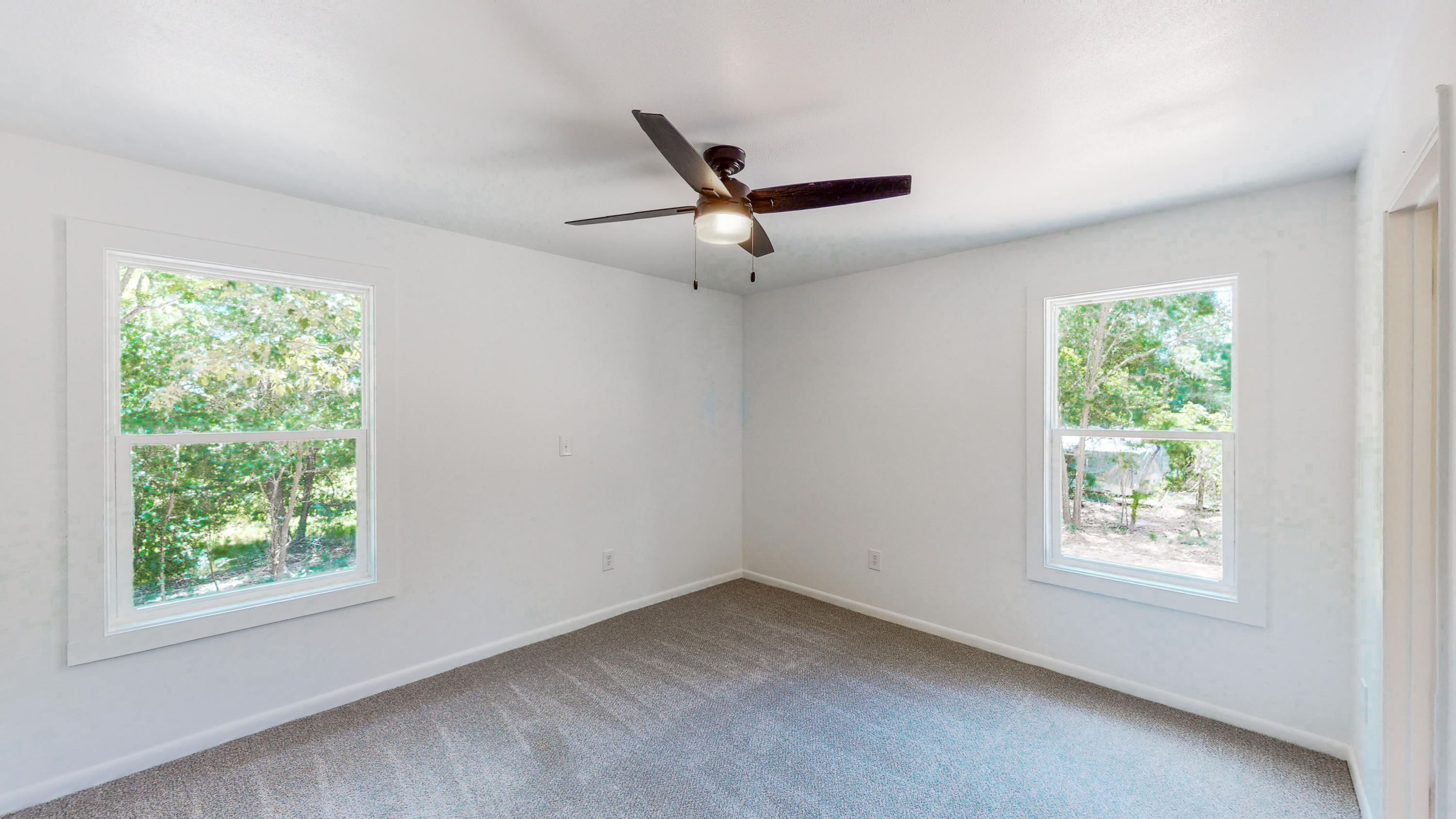 2522 Kingston Road Crestview, FL 32536 - Photo 27 of 43 a view of a livingroom with a ceiling fan and a window