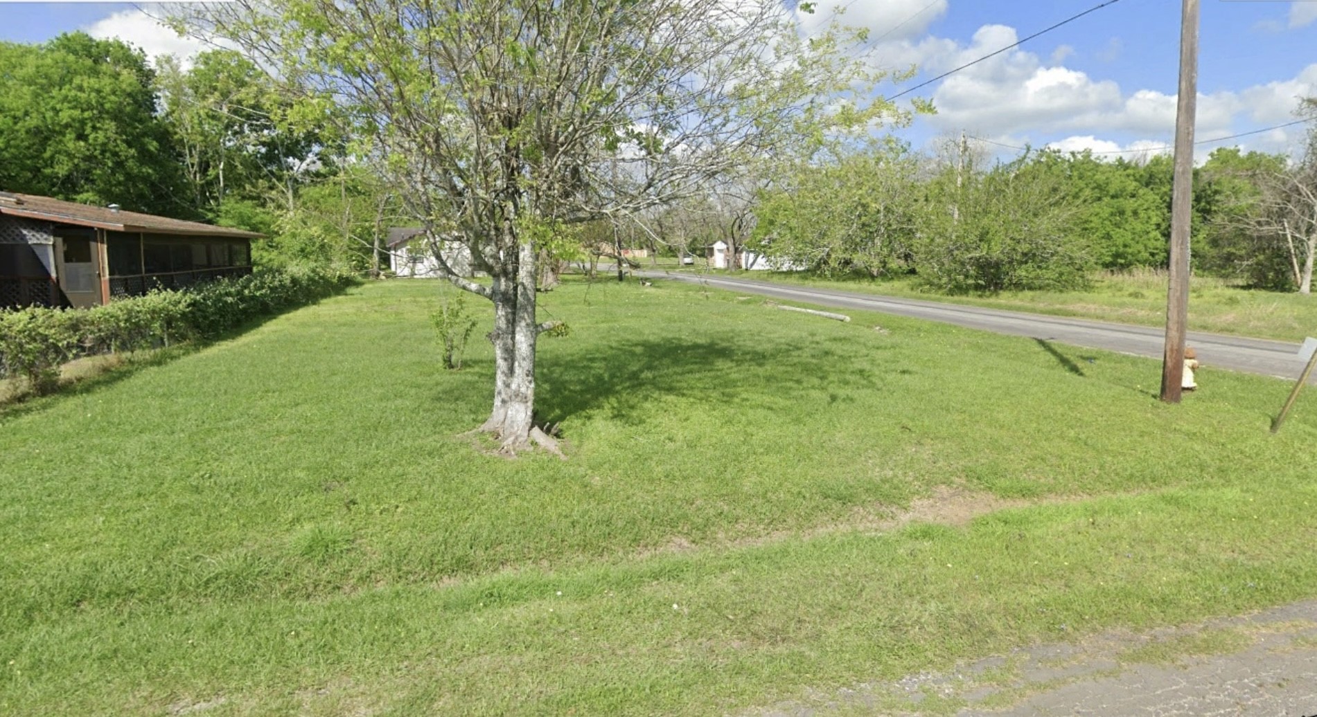 1416 Rugeley Street Bay City, TX 77414 - Photo 5 of 8 a view of a house with a backyard